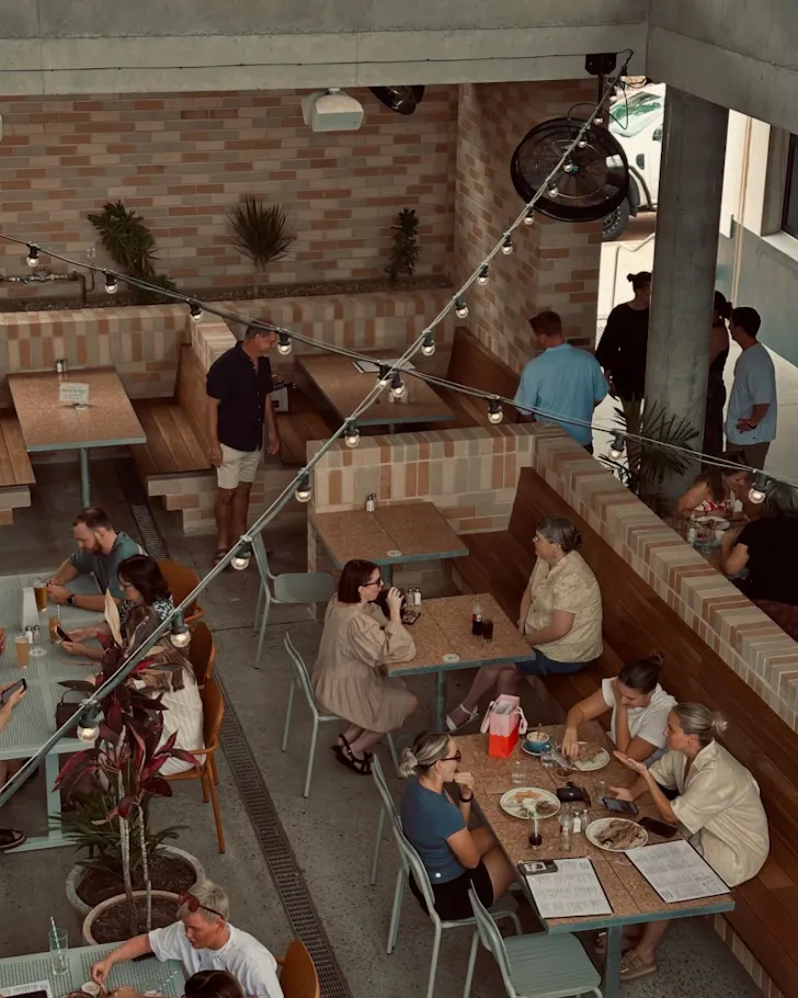 The indoor seating and festoon lights at Flinders Street Wharves.