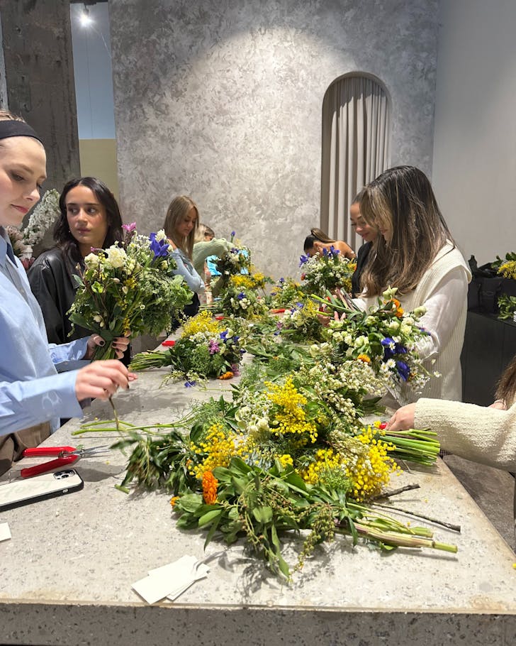 A group of girls arrange flowers