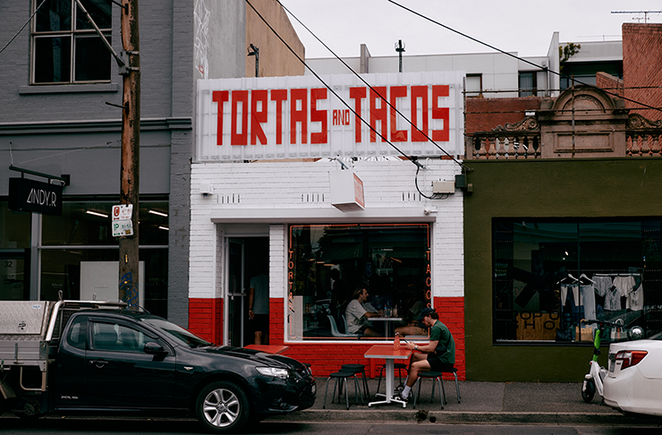 A white-painted brick shopfront of the best Mexican restaurants in Melbourne. 