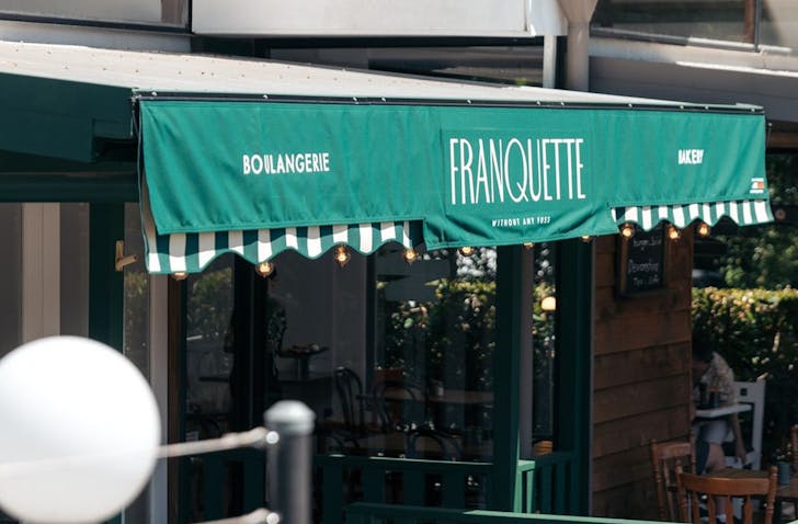 the green signage of a gold coast bakery