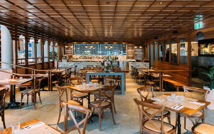 interior of a restaurant with wooden archways