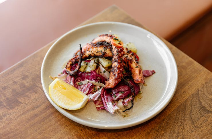 grilled octopus on a salad
