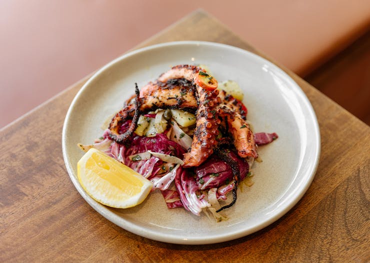grilled octopus on a salad