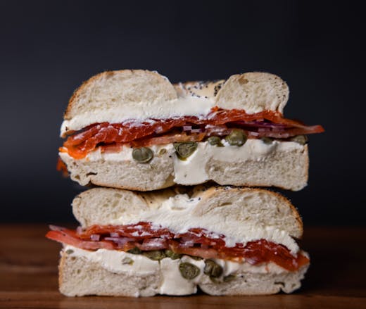 A lox bagel, sliced in half from George Street Deli. 