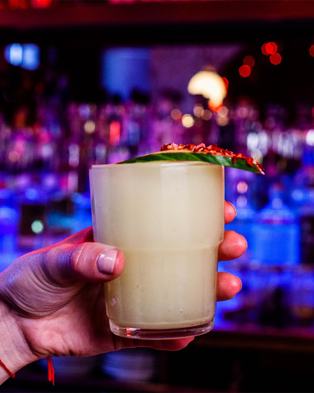 A hand holds the stealth margarita at Ghost Donkey.