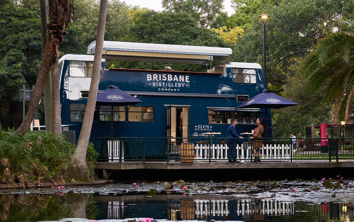 a double decker bus in a garden