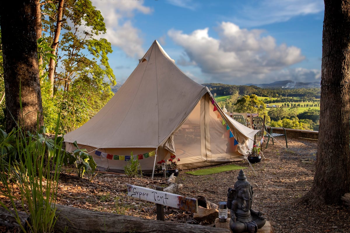 a glamping tent with a view of hinterlands