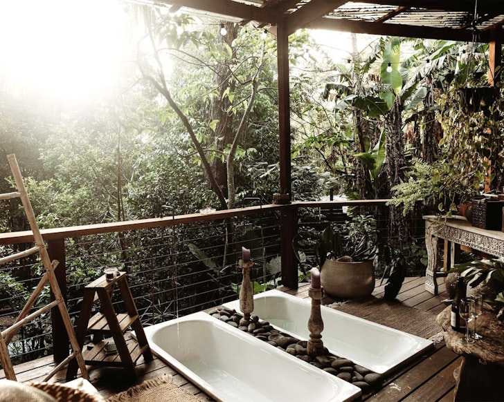 A view of the twin outdoor baths on the deck at Dome In Clunes Airbnb near Brisbane Queensland