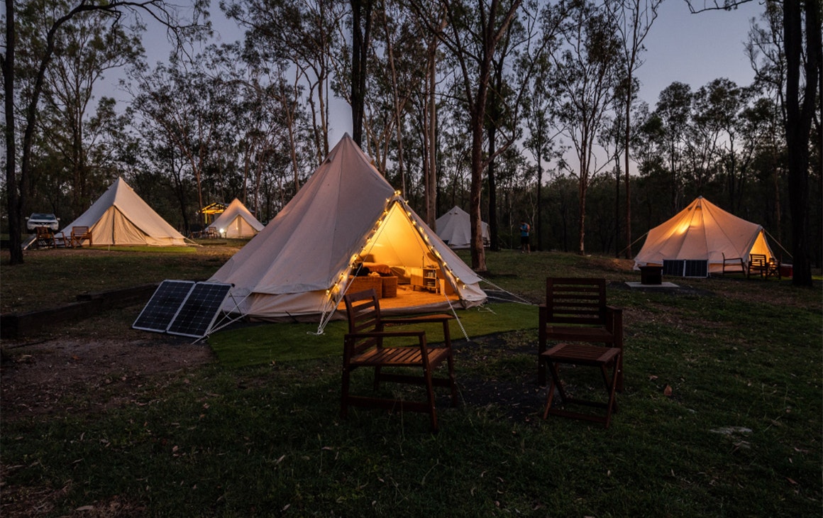 a cotton bell tent with fairy lights