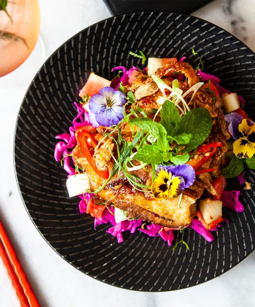 a plate of libertines crispy pork belly