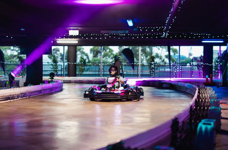 A person in an e-kart on the track at Hyper Karting in Sydney