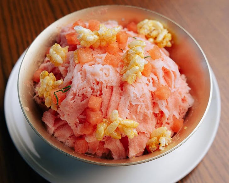 A bowl of limited-edition watermelon bingsoo topped with puffed rice. 