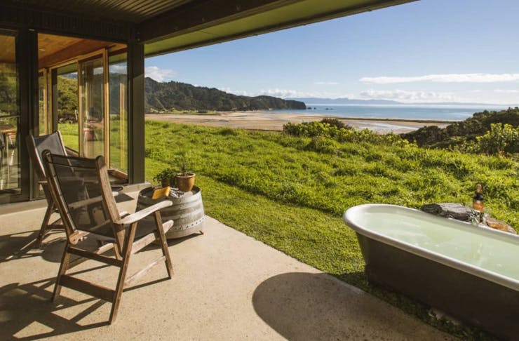 The view out over the sea from the patio and outdoor bath at the Greenie Ecohouse in Golden Bay
