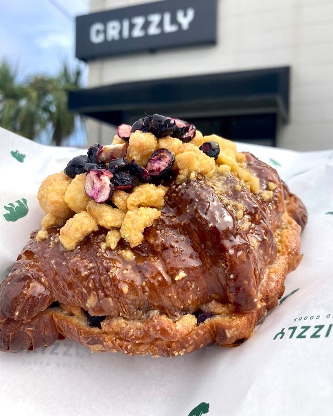 The the Blueberry Cornmeal Crunch.  Filled with a cornmeal and honey frangipane with blueberries, covered in a honey butter glaze topped with freeze dried blueberries from Grizzly.