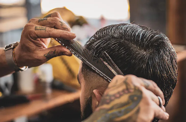 A man gets his hair cut