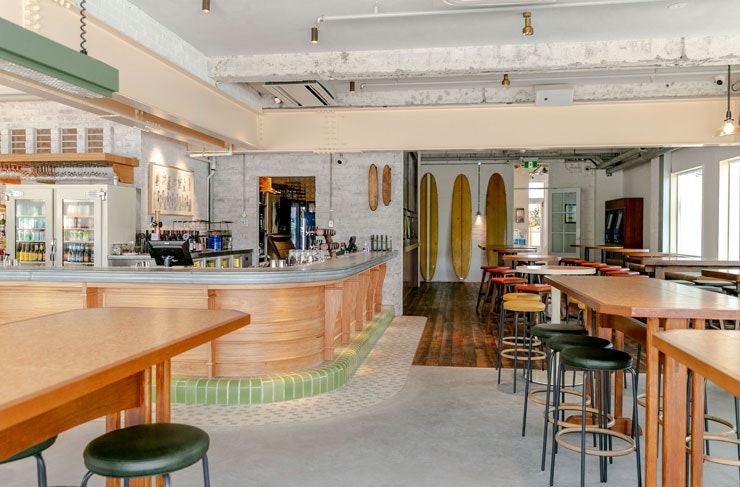 A bar and high tables at the new Harbord Hotel. 