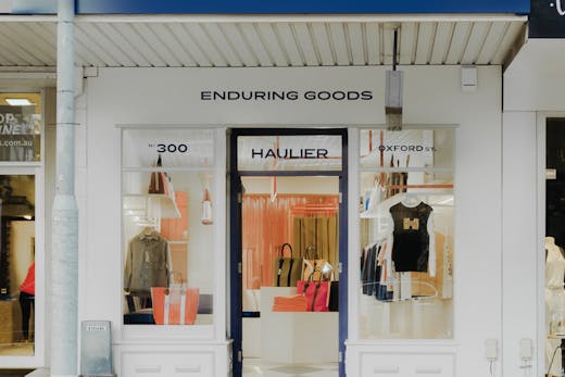 A white shop front outside a fashion boutique.