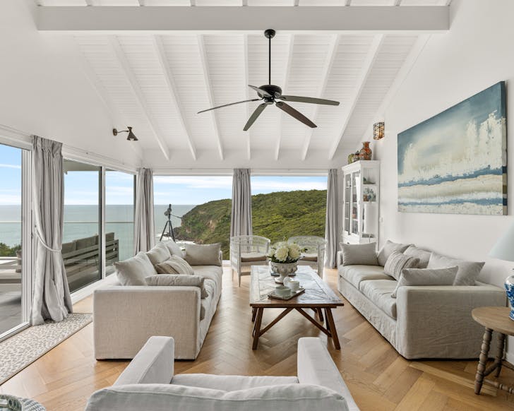 Airbnb living room with panoramic headland views