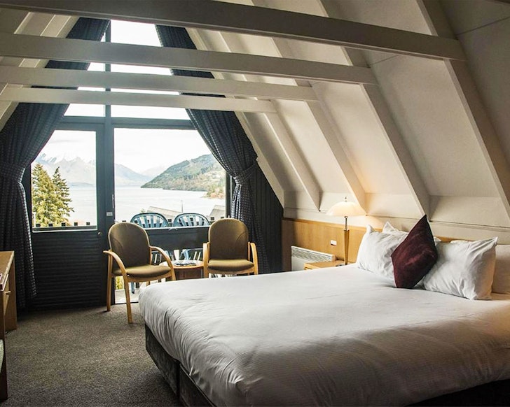A room with a pitched roof at Heartland Hotel one of the best Queenstown hotels