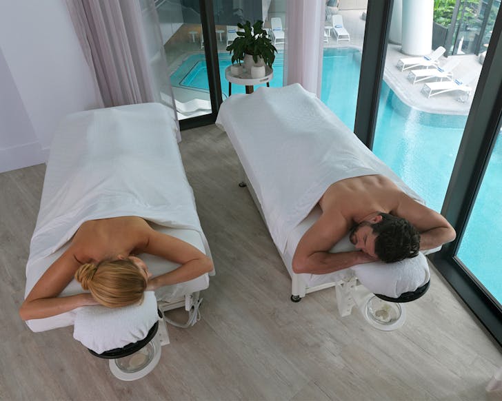 a couple getting a massage at brisbane spa heavenly by westin