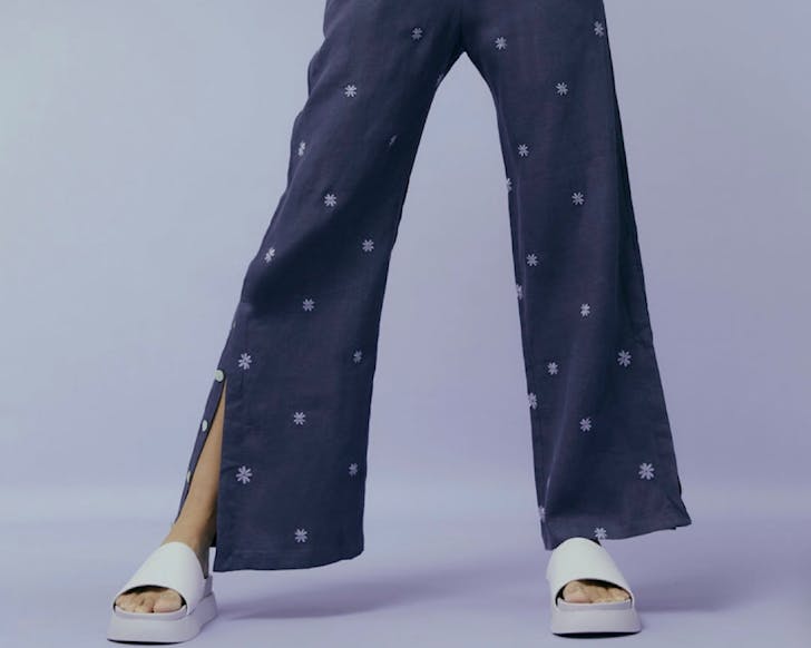 Flared linen âsweetpantsâ by hej hej with an outer leg split.