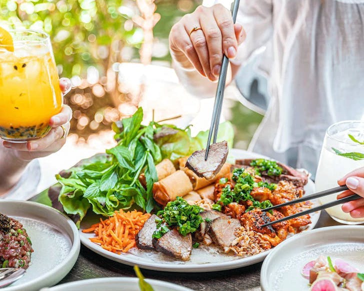 Chopsticks and plate of food