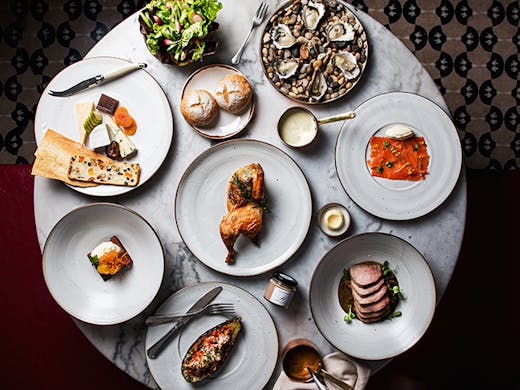 A top down shot of a luxurious feast from Hemingway's Dining Room.