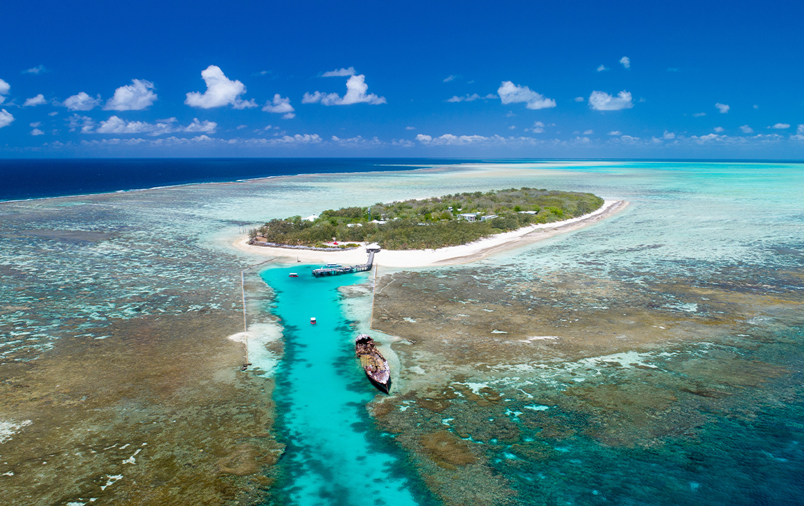 a small Queensland island surrounded by reefs