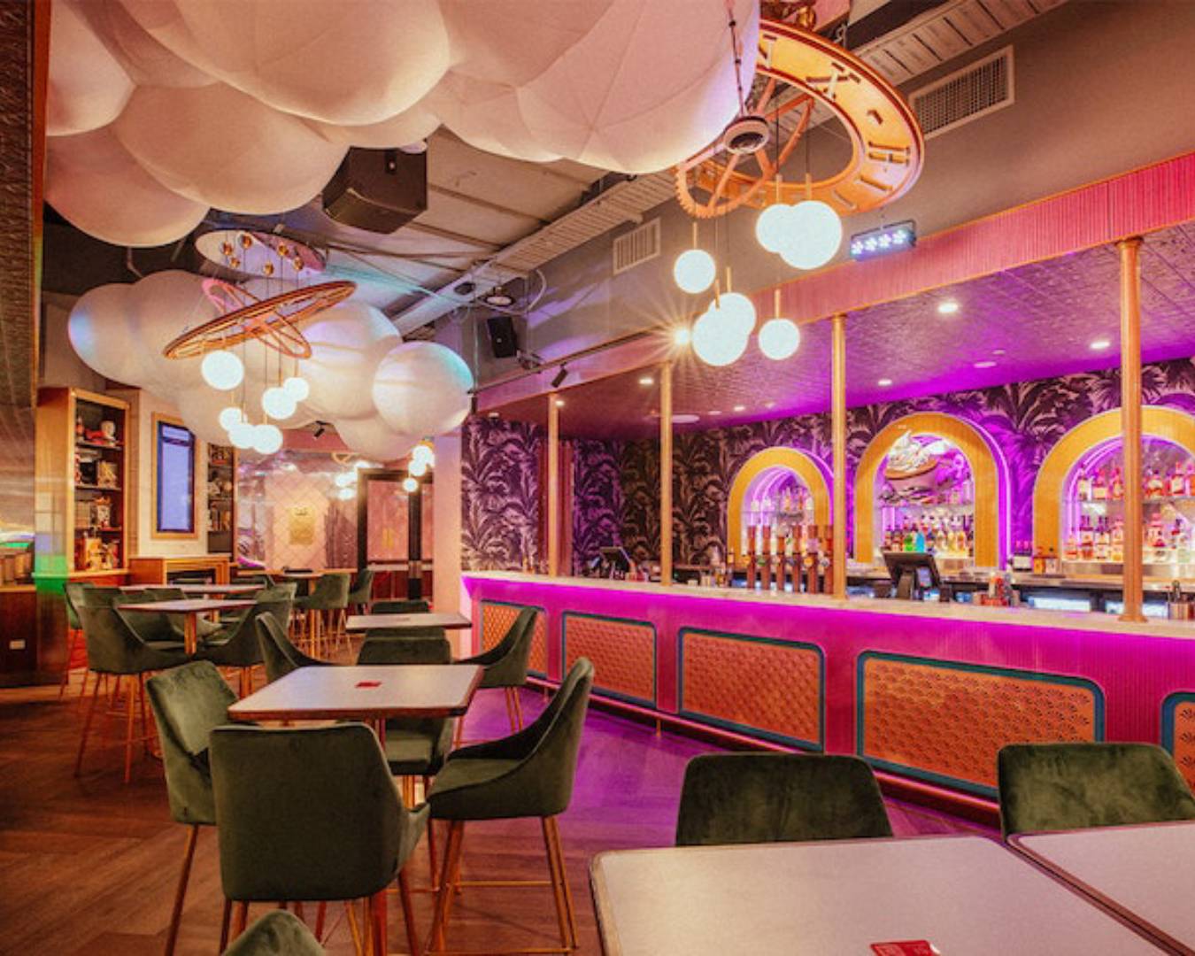 pink hotel interior with tables and bar at hijinx hotel, a brisbane date idea