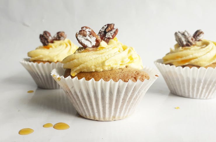 Vanilla cupcakes with maple frosting and candied pecans