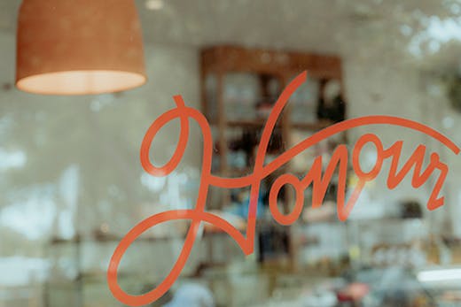 a red window decal that says