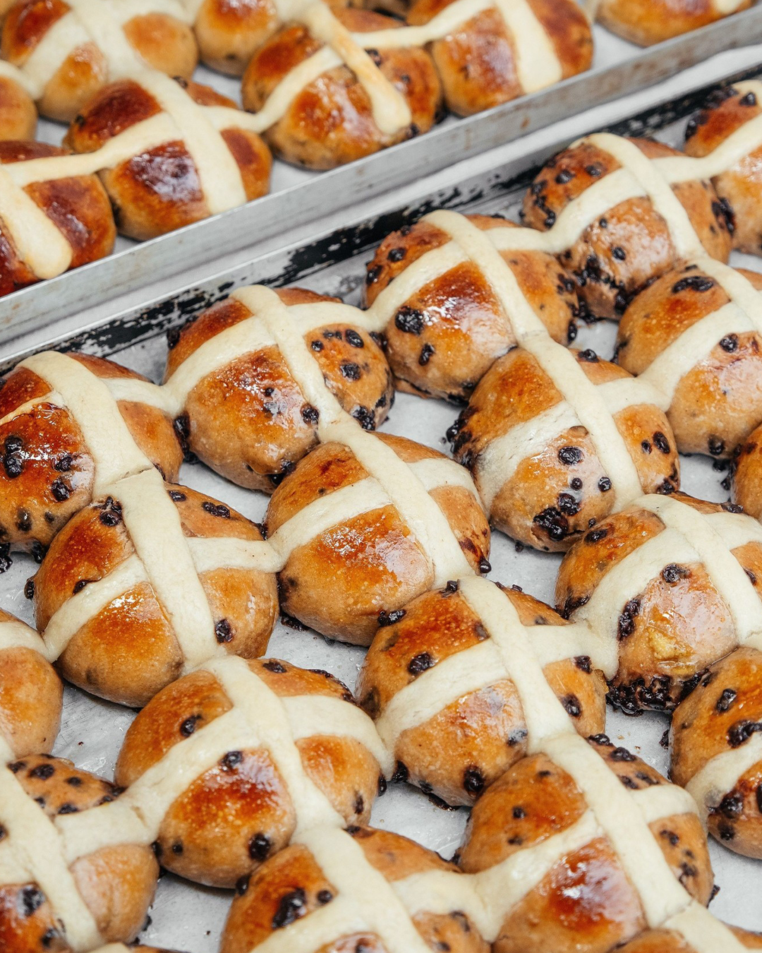 a tray of hot cross buns