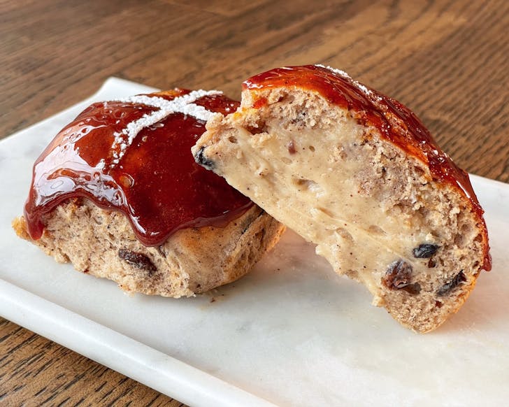 a hot cross bun with a crunchy sugar top from sydney bakery madame and yves in clovelly