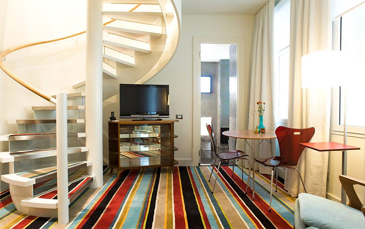 A view of a gorgeous split level room at Hotel DeBrett, one of the best hotels in Auckland.