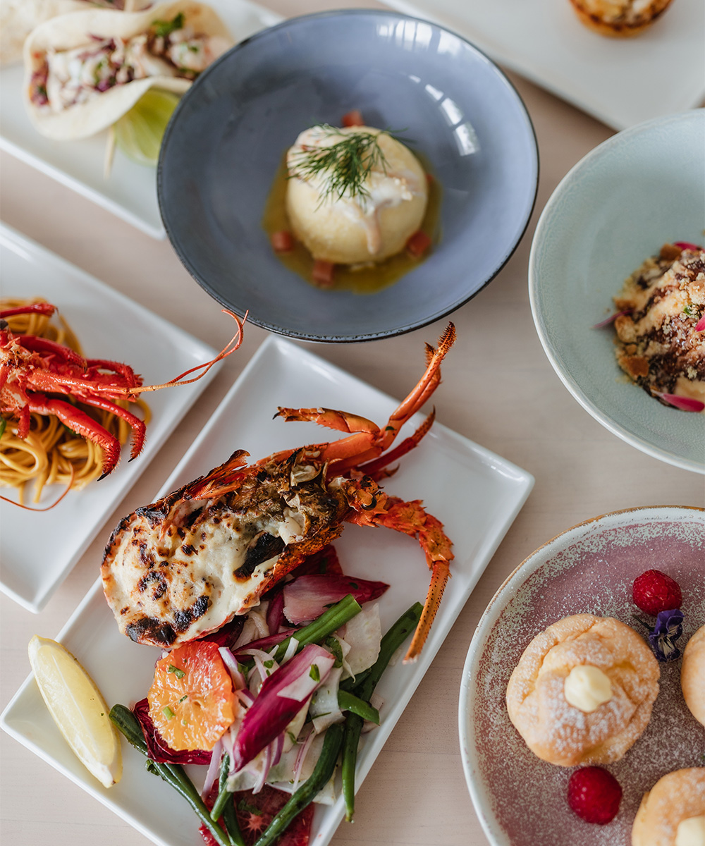 a bunch of dishes from the lobster menu on a table