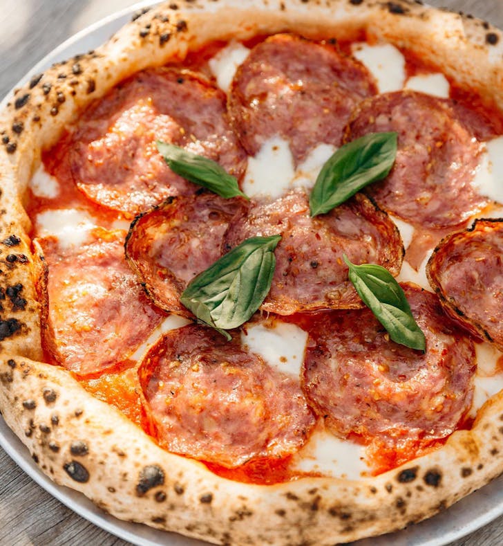 a pepperoni topped pizza