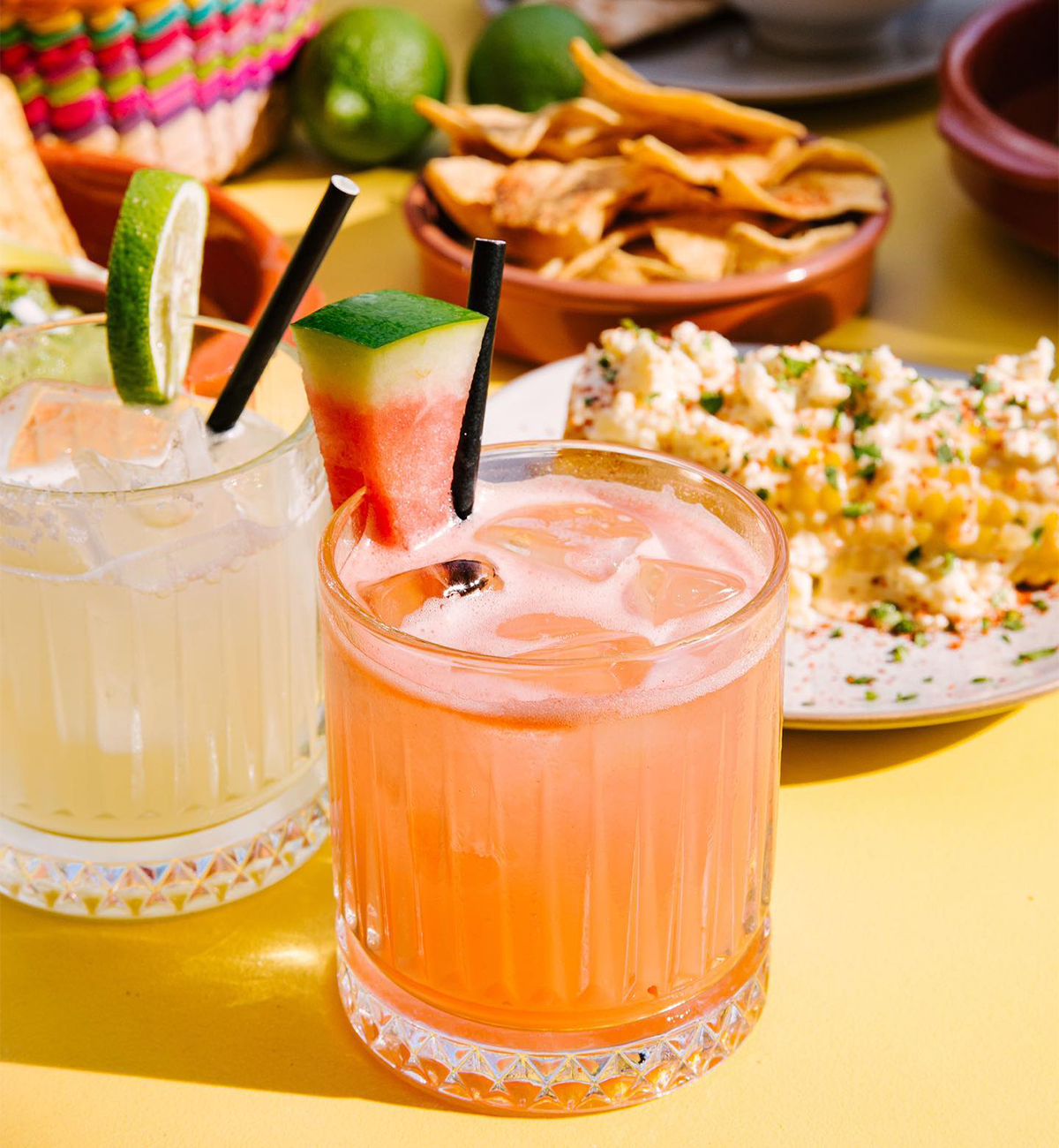 mexican dishes and margs on a table