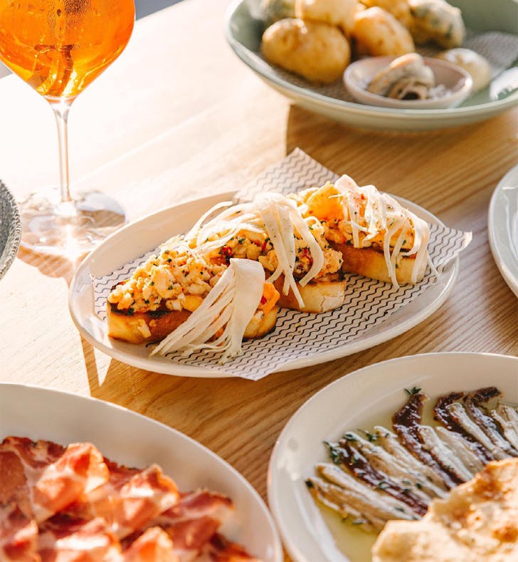 several different dishes and cocktails on a table