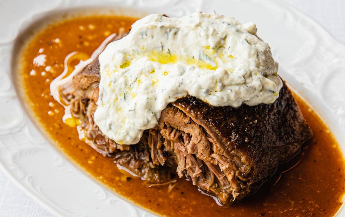 a plate of slow cooked lamb shoulder from greca