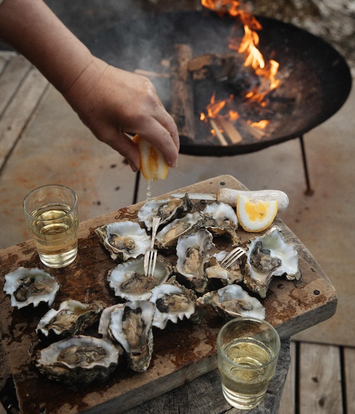 Oysters shucked by a fire pit