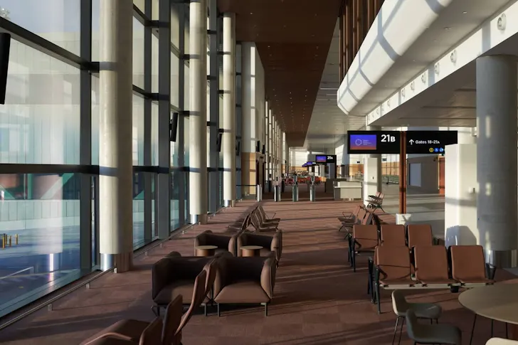 Terminal with brown couches and screens inside Western Sydney International Airport.