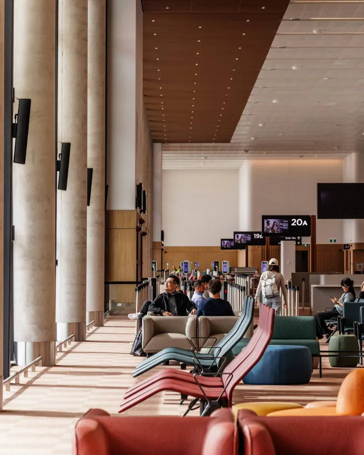 Waiting lounge with colourful chairs at Western Sydney International Airport.