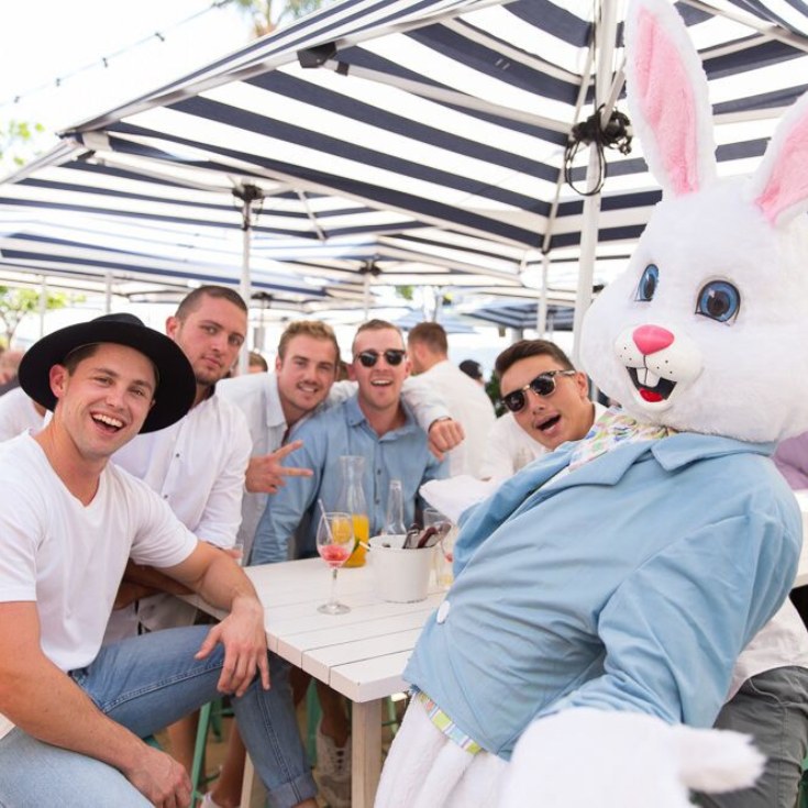 friends gathered around a table with the easter bunny at watsons bay boutique hotel