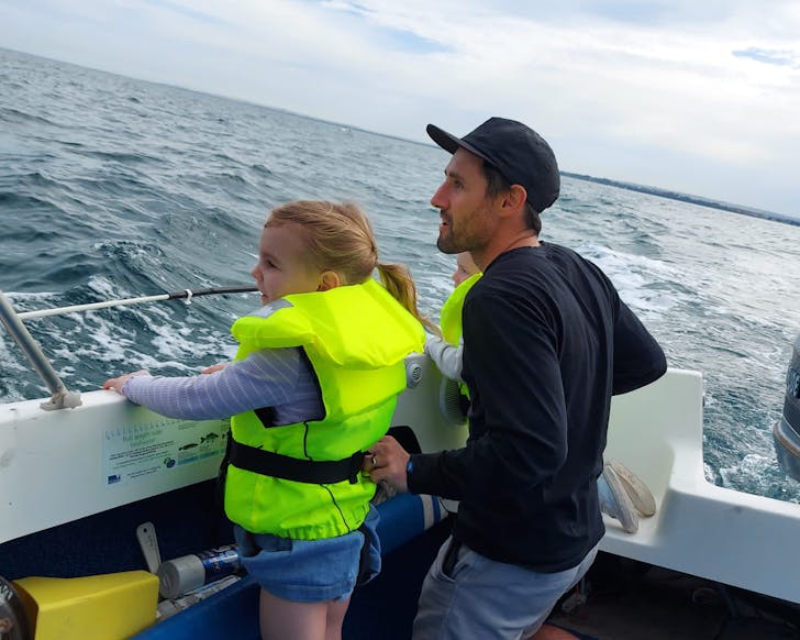girl and man life jacket boat