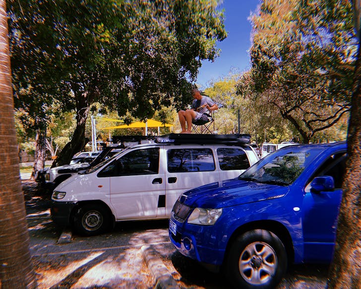 battery world van with man on roof 