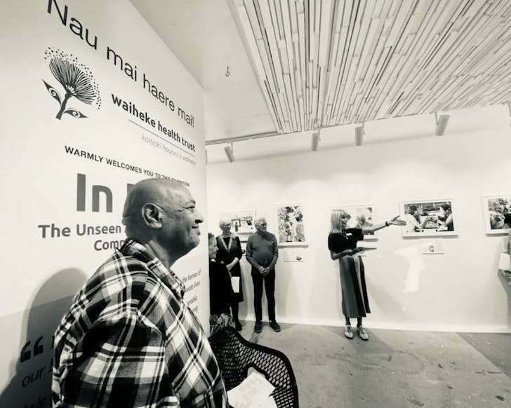 People enjoy the opening of 'In Focus' exhibition.