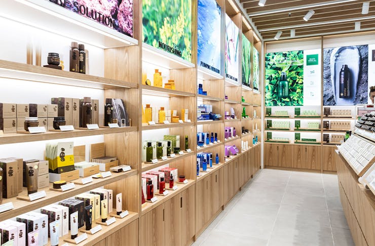 interior of an innisfree store, with shelves lined with colourful bottles.