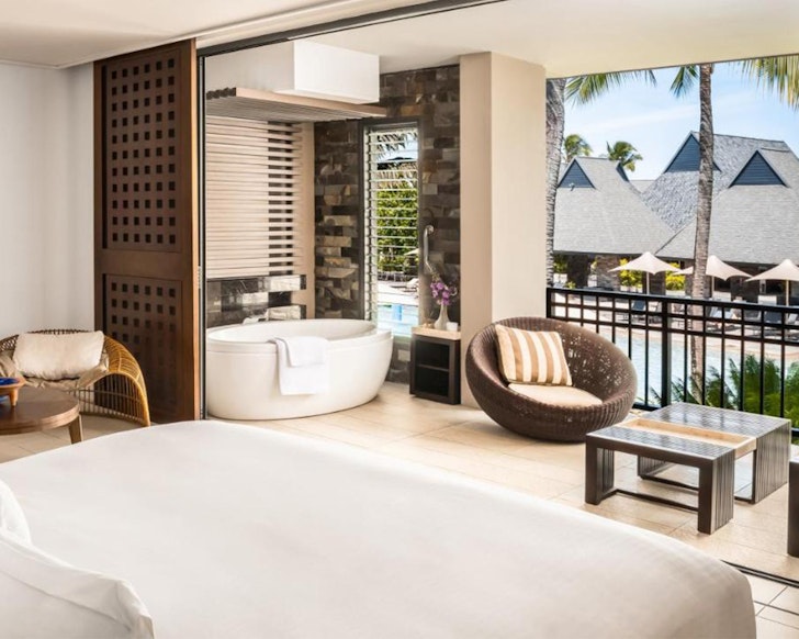 a room with a bath on the balcony at intercontinental Fiji resort
