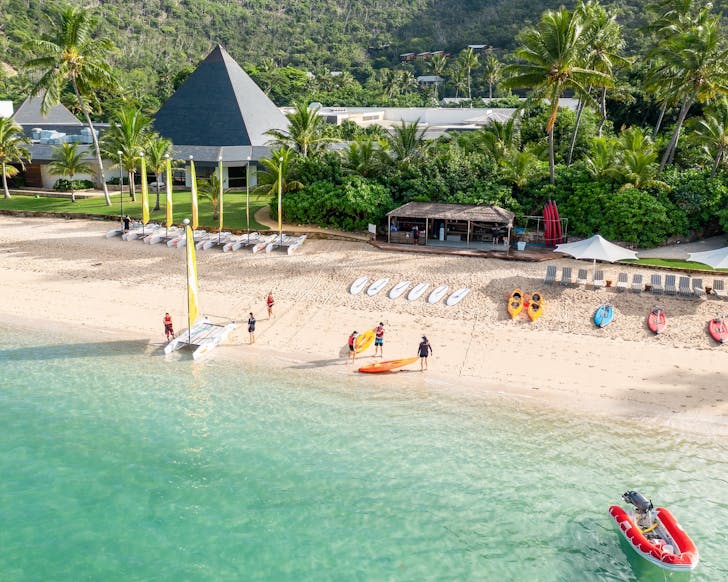 the beautiful main beach of intercontinental hayman great barrier reef, with free paddleboard and kayak hire