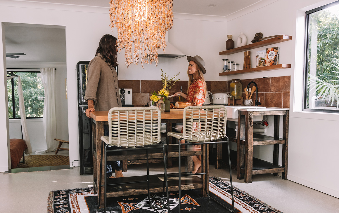 two people in a boho cottage kitchen